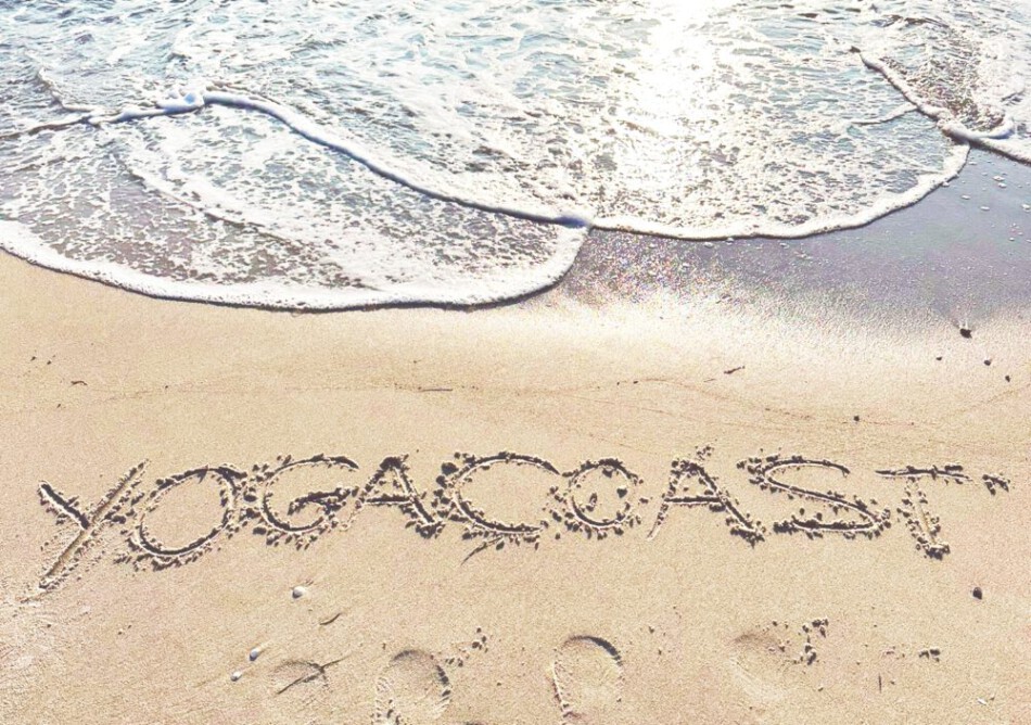 Impressum. Yogacoast mit Schriftzug in den Sand geschrieben